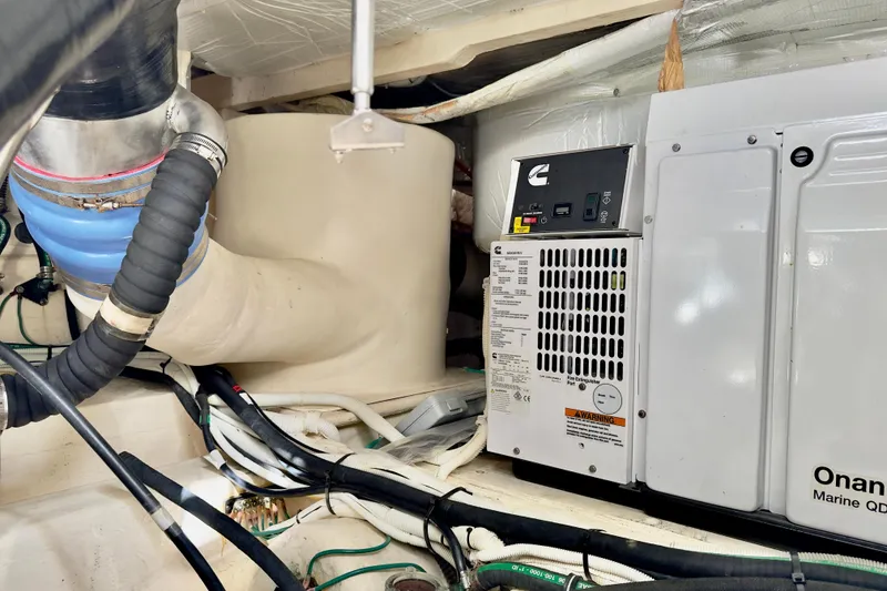 Slide: The Image of Engine room of 2020 Tiara Yachts F53 Flybridge with Onan Marine generator. - 31