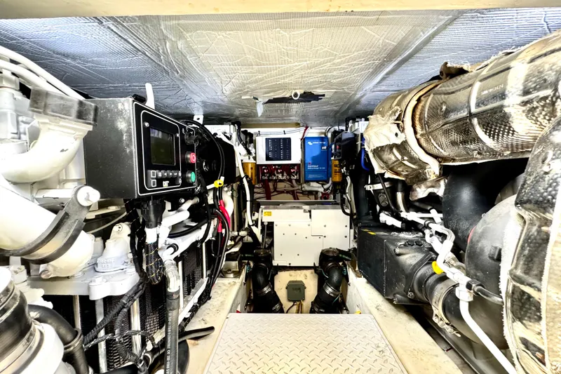 Slide: The Image of Engine room of 2020 Tiara Yachts F53 Flybridge, showcasing advanced machinery and equipment. - 32