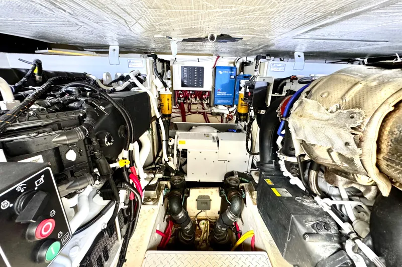 Slide: The Image of Engine room of 2020 Tiara Yachts F53 Flybridge, showcasing mechanical components and systems. - 33
