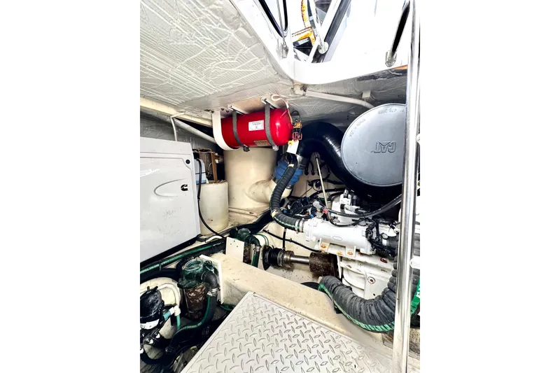 Slide: The Image of Engine room of 2020 Tiara Yachts F53 Flybridge, featuring mechanical components and equipment. - 35