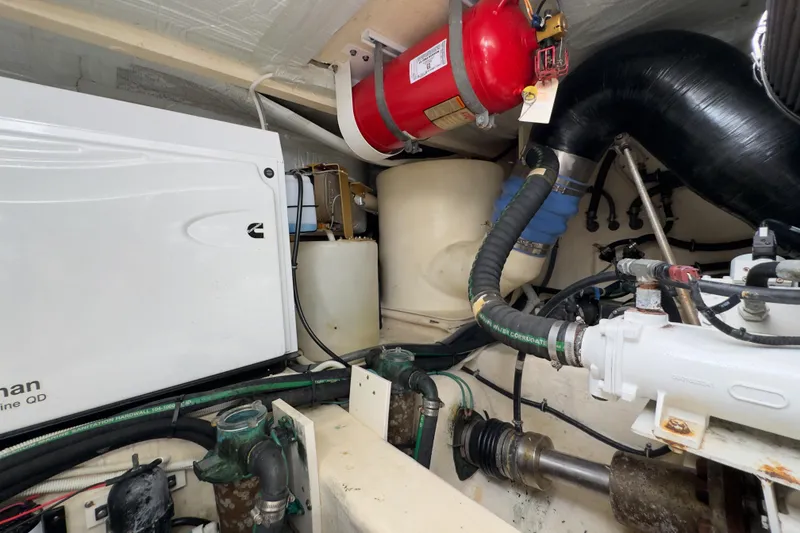 Slide: The Image of Engine room of 2020 Tiara Yachts F53 Flybridge with Cummins generator and fire extinguisher. - 36