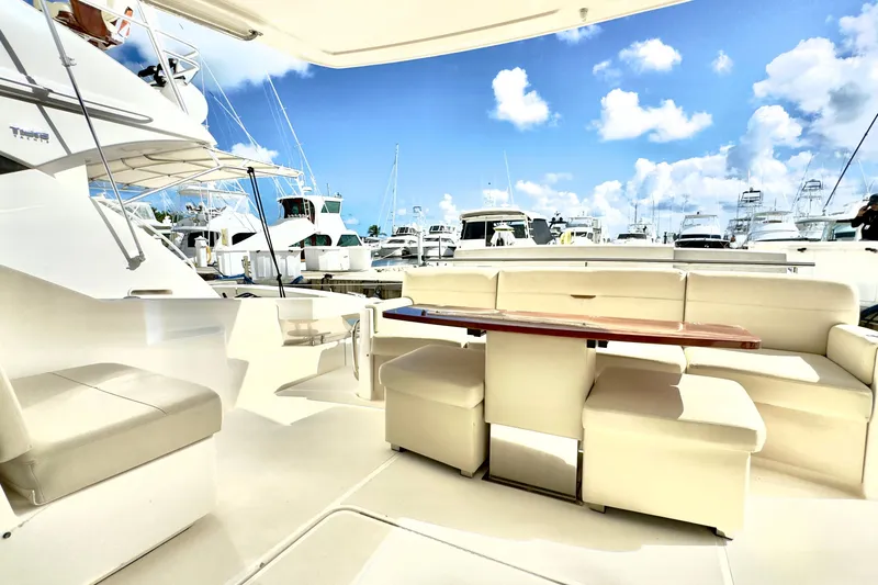 Slide: The Image of Luxurious 2020 Tiara Yachts F53 Flybridge with spacious seating and marina view. - 6