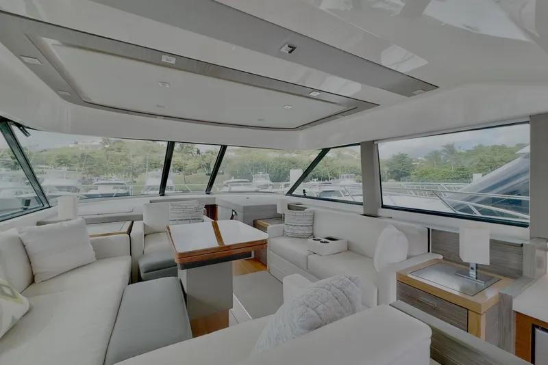 Slide: The Image of Luxurious interior of 2020 Tiara Yachts F53 Flybridge with elegant seating and panoramic windows. - 7