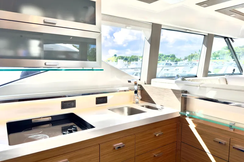 Slide: The Image of Luxurious kitchen interior of 2020 Tiara Yachts F53 Flybridge with modern amenities. - 9