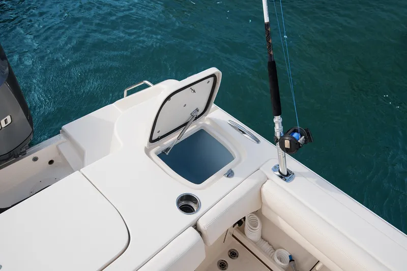 Slide: The Image of 2023 Grady-White Canyon 271 boat deck with fishing rod holder and storage compartment. - 10