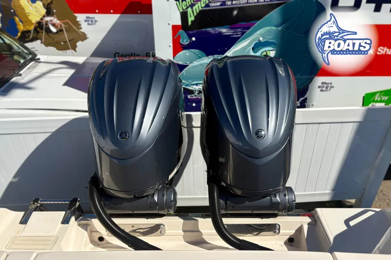 Slide: The Image of Twin Yamaha outboard engines on a 2023 Grady-White Canyon 271 boat. - 11