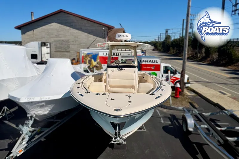 Slide: The Image of 2023 Grady-White Canyon 271 boat on display at dealership, front view. - 3
