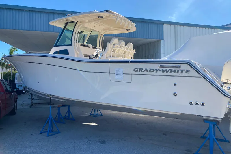 The Image of 2026 Grady-White Canyon 336 boat on stands, displayed outdoors. - 0