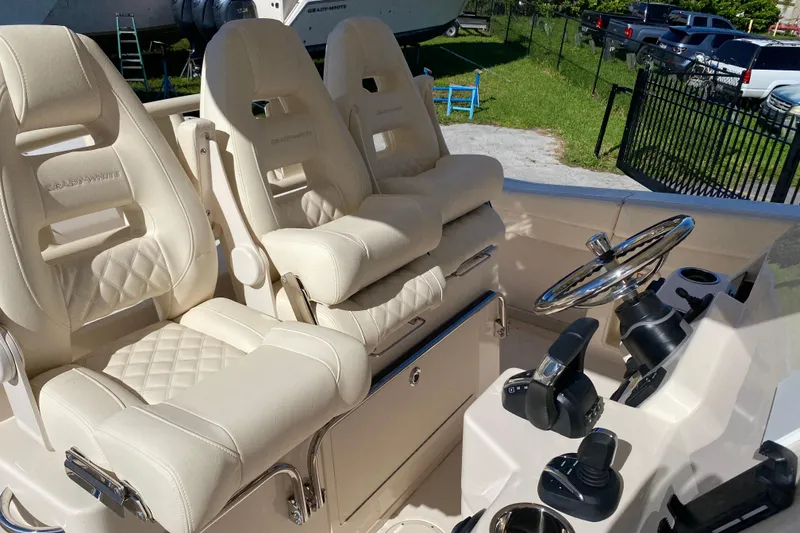 Slide: The Image of Luxurious seating and helm of 2026 Grady-White Canyon 336 boat. - 11