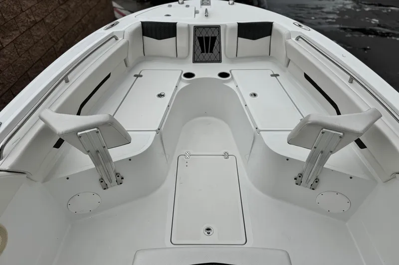 Slide: The Image of 2022 Wellcraft 222 Scarab Offshore boat interior with seating and storage compartments. - 11