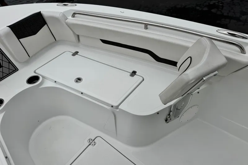 Slide: The Image of 2022 Wellcraft 222 Scarab Offshore boat interior with seating and storage compartments. - 13