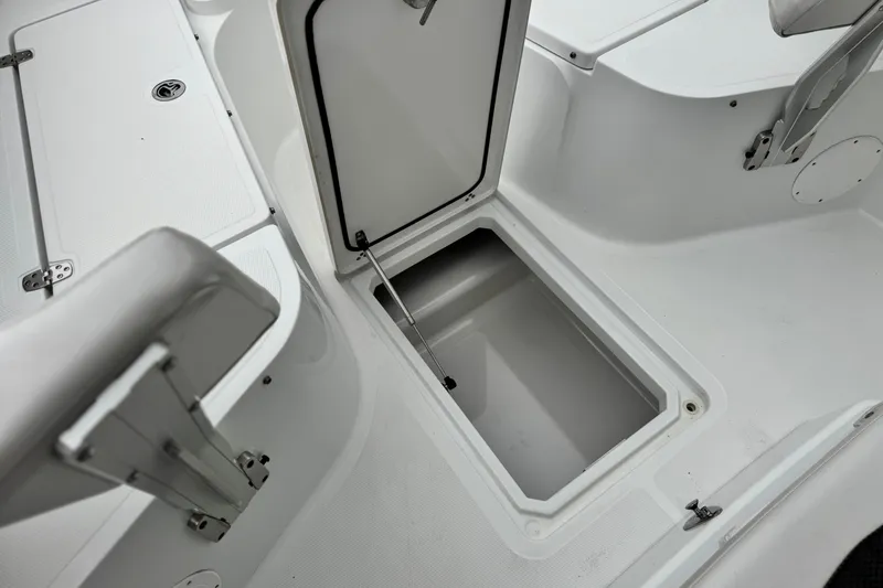 Slide: The Image of 2022 Wellcraft 222 Scarab Offshore boat storage compartment, open and spacious interior view. - 15