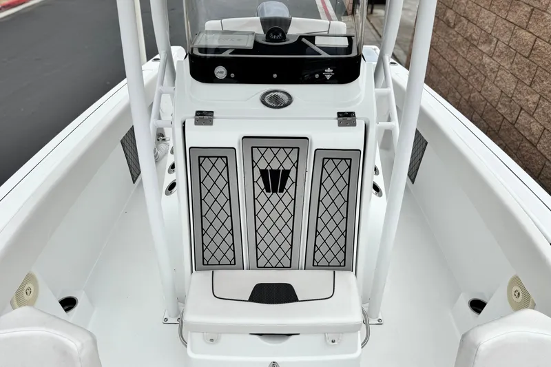 Slide: The Image of 2022 Wellcraft 222 Scarab Offshore boat interior with sleek design and storage compartments. - 16
