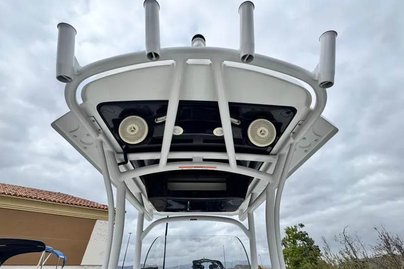 Slide: The Image of 2022 Wellcraft 222 Scarab Offshore boat top view with rod holders and speakers. - 26