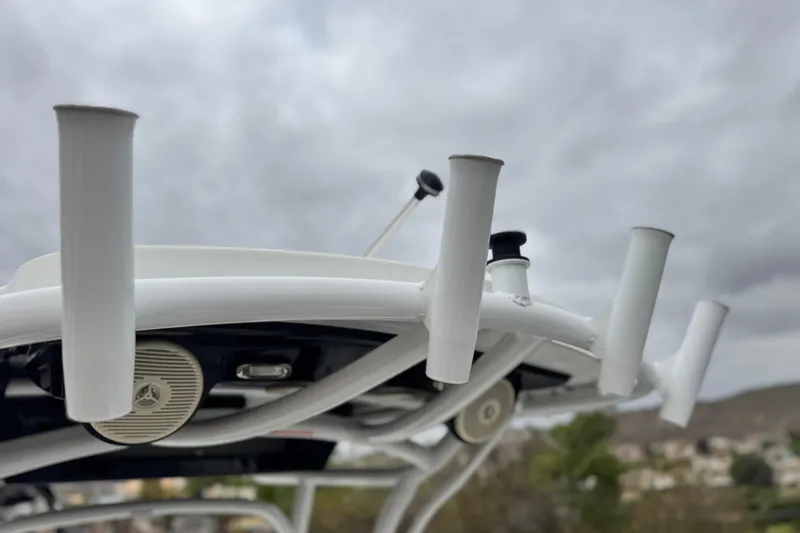 Slide: The Image of 2022 Wellcraft 222 Scarab Offshore boat roof with rod holders and speaker. - 28