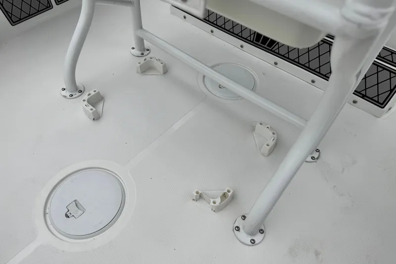 Slide: The Image of 2022 Wellcraft 222 Scarab Offshore boat deck with storage compartments and seating fixtures. - 34