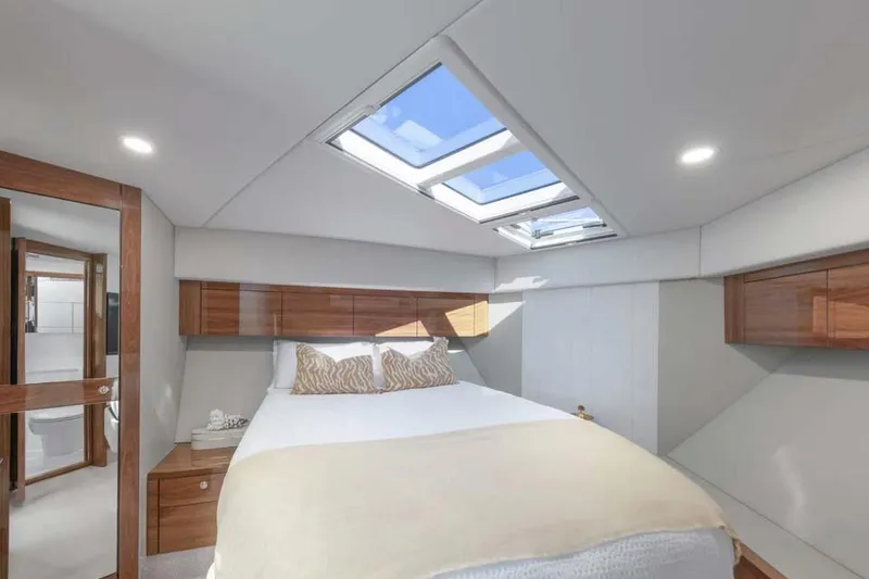 Slide: The Image of Manufacturer Provided Image: Luxurious Maritimo M50 2026 yacht bedroom with skylight and elegant wood accents. - 7