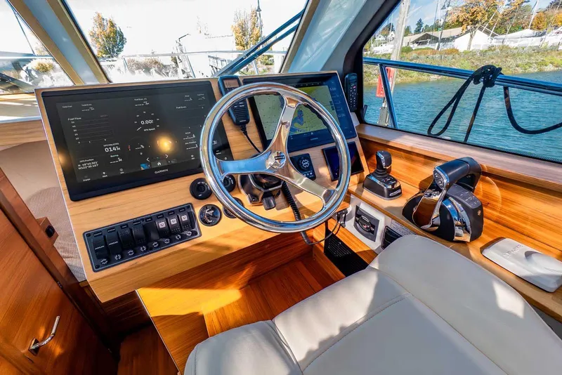Slide: The Image of 2020 Coastal Craft 33 Express helm with modern navigation and control systems. - 15