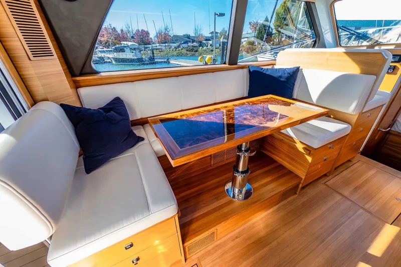 Slide: The Image of Luxurious interior of 2020 Coastal Craft 33 Express yacht with elegant wood and leather seating. - 17