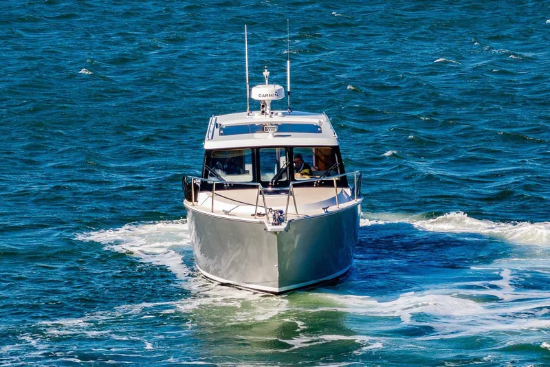 Slide: The Image of 2020 Coastal Craft 33 Express cruising on open water. - 2