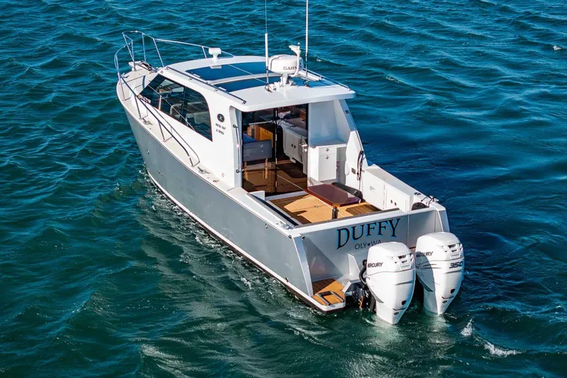 Slide: The Image of 2020 Coastal Craft 33 Express boat cruising on open water. - 4