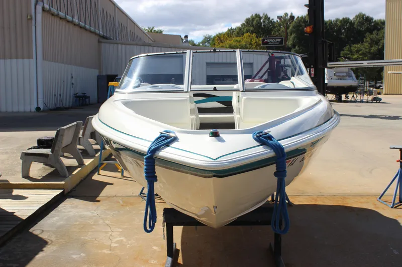 Slide: The Image of 2000 Wellcraft 186 SS/S boat on display at a marina, front view. - 10