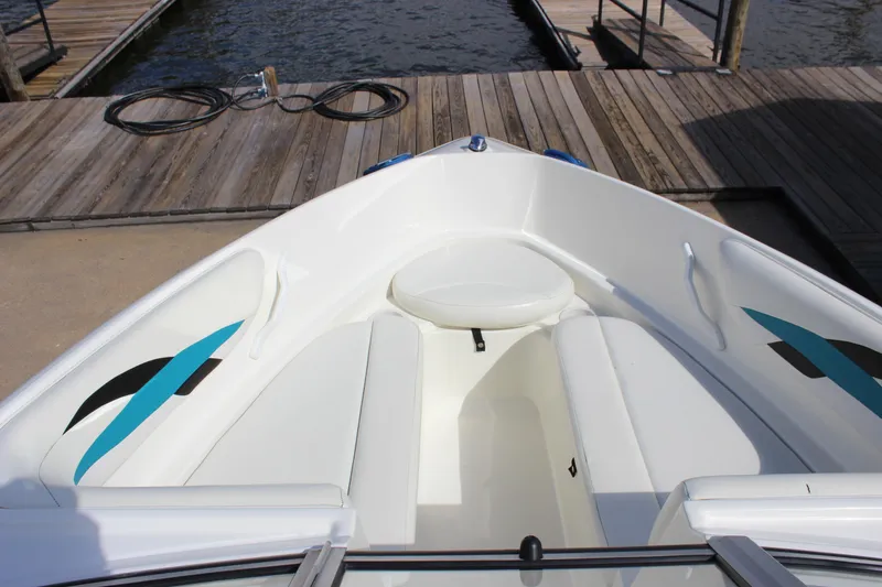 Slide: The Image of Bow seating area of a 2000 Wellcraft 186 SS/S boat at a dock. - 17