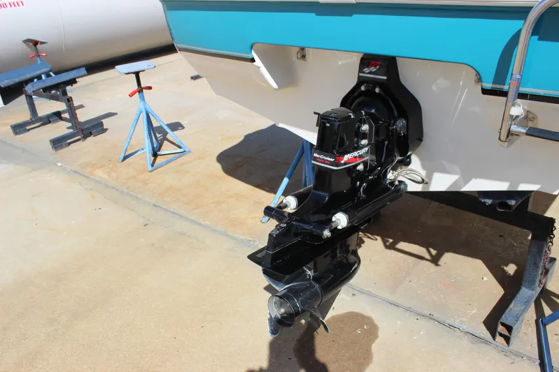 Slide: The Image of 2000 Wellcraft 186 SS/S boat with MerCruiser outboard motor on dry dock. - 2