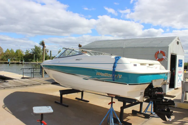 Slide: The Image of 2000 Wellcraft 186 SS/S boat on stand by waterfront dock. - 4