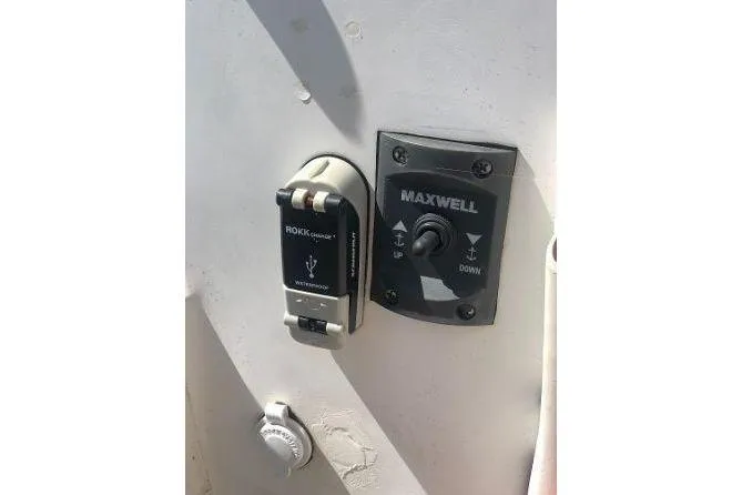 Slide: The Image of Control panel on 1982 Tartan 33 boat featuring Maxwell switch and ROKK charger. - 13