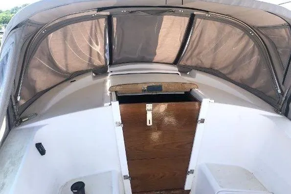 Slide: The Image of 1982 Tartan 33 sailboat cockpit with wooden hatch and protective canopy. - 14