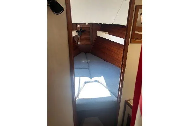 Slide: The Image of Interior cabin of 1982 Tartan 33 sailboat with cozy sleeping area. - 20