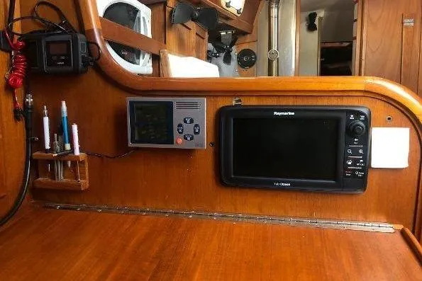 Slide: The Image of 1982 Tartan 33 sailboat navigation equipment with Raymarine display and control panel. - 24