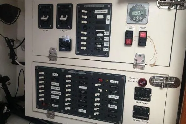 Slide: The Image of Electrical control panel on a 1982 Tartan 33 sailboat, featuring switches and gauges. - 27