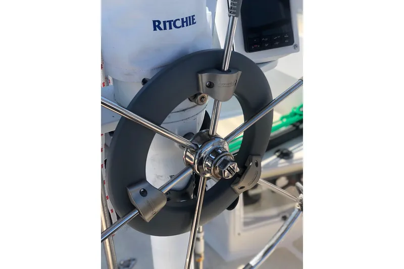 Slide: The Image of Steering wheel of a 1982 Tartan 33 sailboat with navigation equipment. - 7