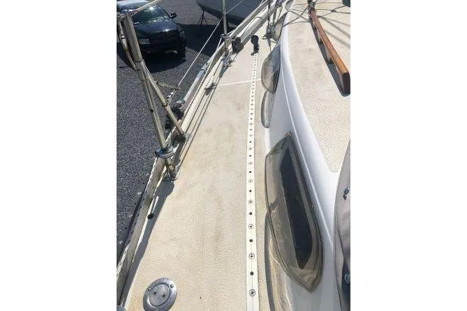Slide: The Image of 1982 Tartan 33 sailboat deck with rigging and windows visible. - 8