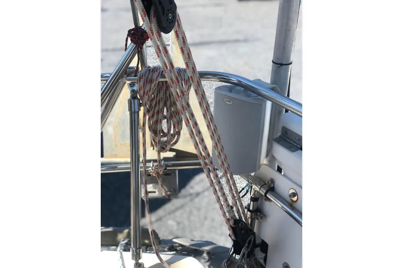 Slide: The Image of 1982 Tartan 33 sailboat rigging with ropes and speaker on deck. - 9