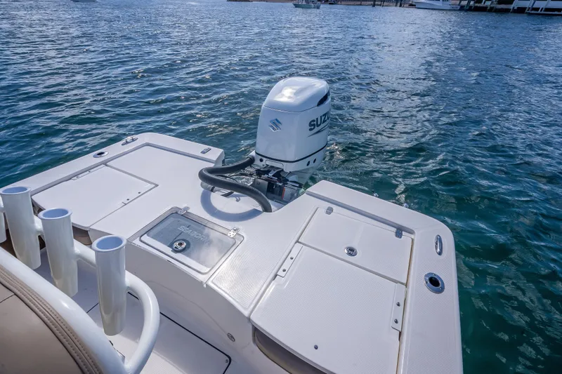 Slide: The Image of 2026 Sea Born FX22 Bay boat with Suzuki outboard motor on calm water. - 21