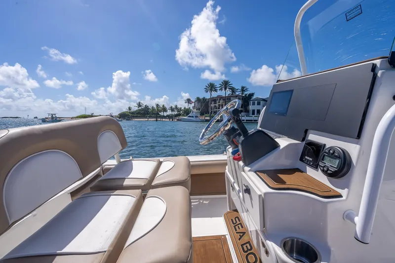 Slide: The Image of 2026 Sea Born FX22 Bay boat interior with scenic waterfront view. - 28