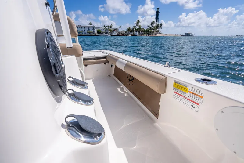 Slide: The Image of 2026 Sea Born FX22 Bay boat interior with ocean view and distant lighthouse. - 29