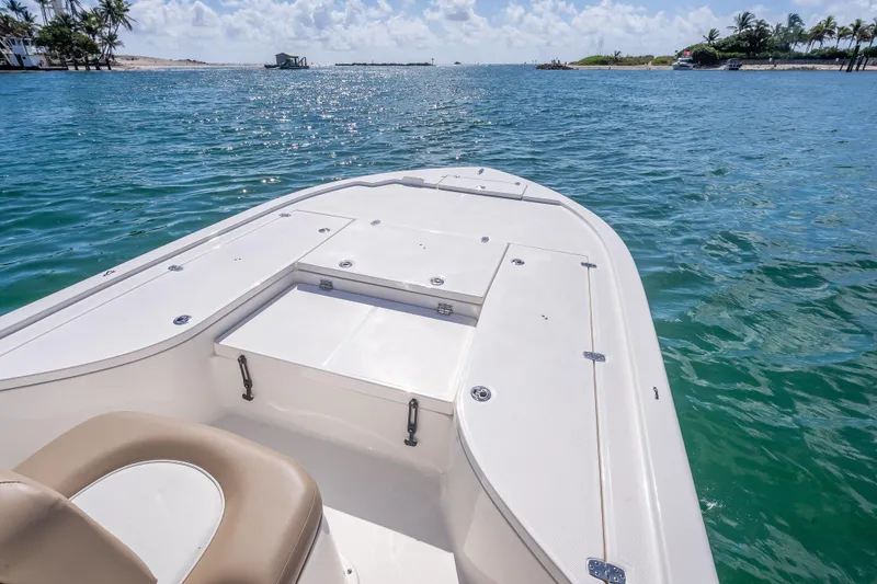 Slide: The Image of 2026 Sea Born FX22 Bay boat on tranquil blue water, sunny day. - 31