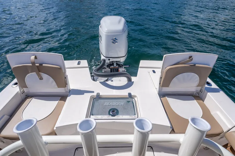 Slide: The Image of 2026 Sea Born FX22 Bay boat with seating and motor on calm water. - 44
