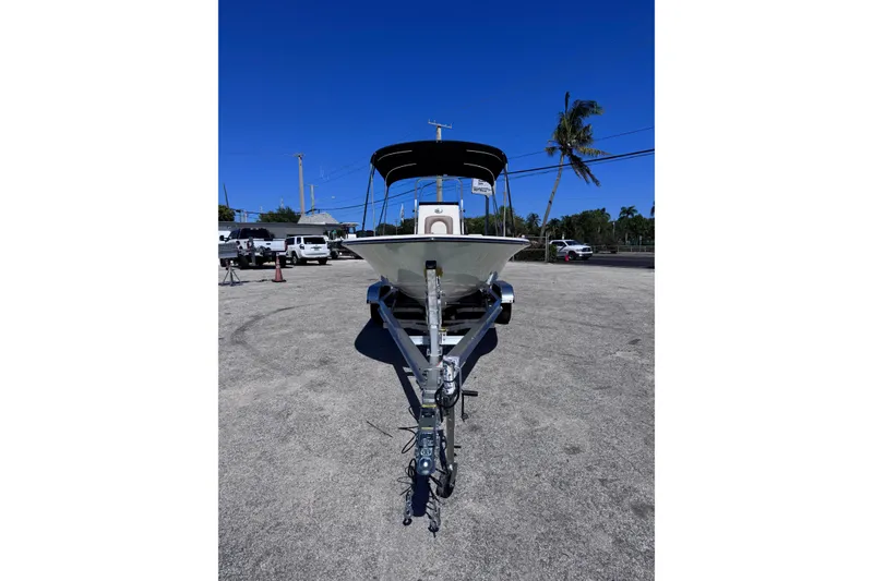 Slide: The Image of 2026 Sea Born FX22 Bay boat on trailer under clear blue sky. - 7