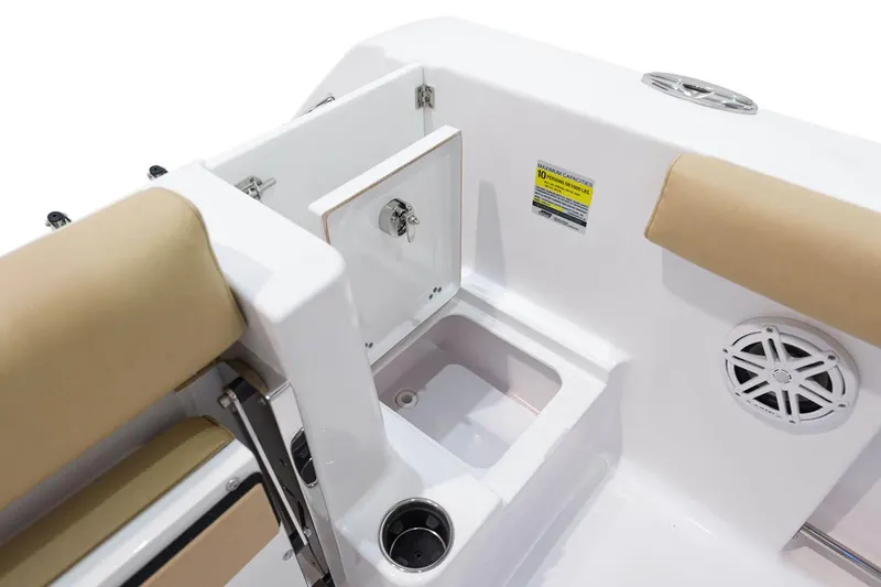 Slide: The Image of Storage compartment in 2023 Sportsman Open 232 Center Console with life jackets and safety gear. - 16