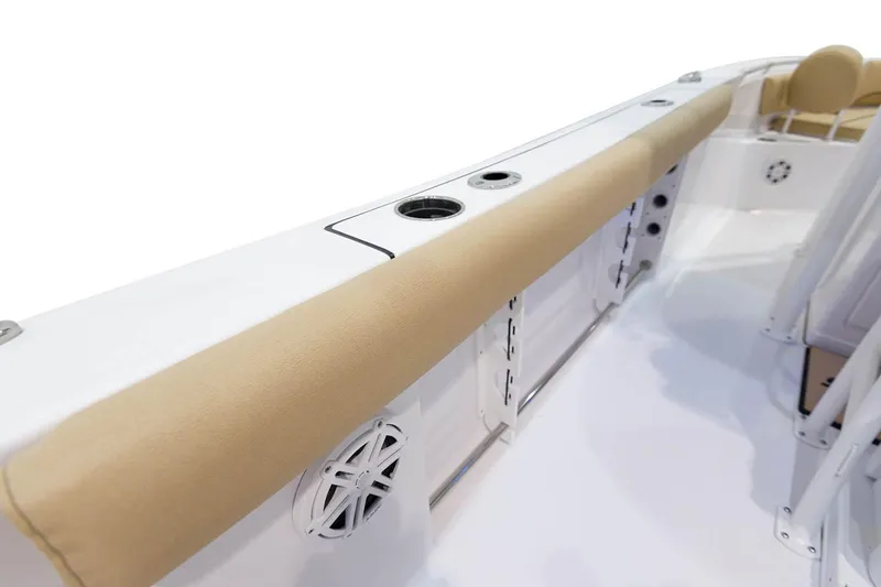 Slide: The Image of 2023 Sportsman Open 232 Center Console boat's overhead storage and speakers. - 18