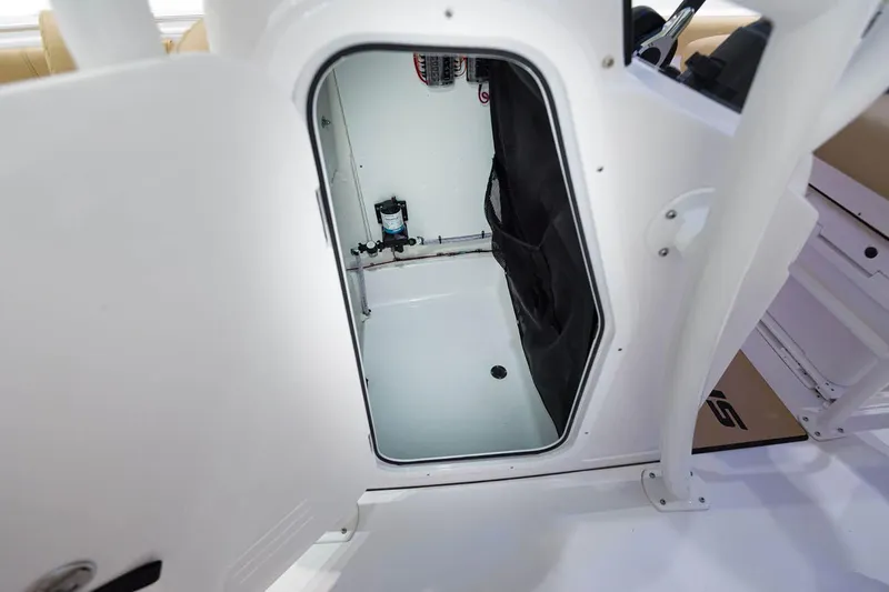 Slide: The Image of 2023 Sportsman Open 232 Center Console boat on trailer, side view in outdoor setting. - 20