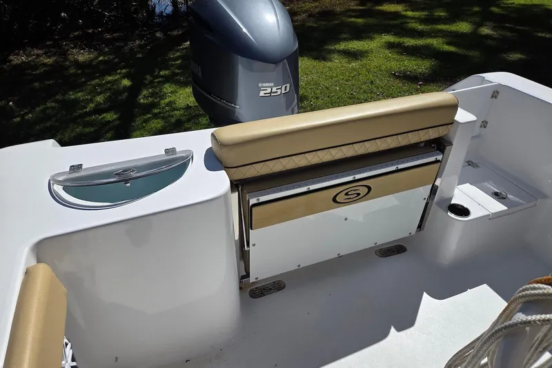 Slide: The Image of 2023 Sportsman Open 232 Center Console boat interior with Yamaha 250 engine, seating, and storage. - 33