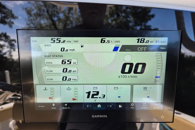 Slide: The Image of Garmin display on 2023 Sportsman Open 232 Center Console showing trip and boat status data. - 35