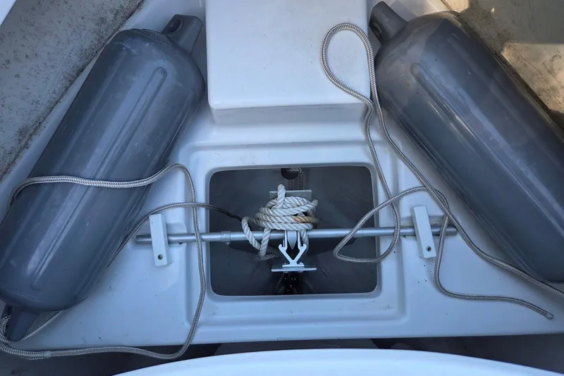 Slide: The Image of 2023 Sportsman Open 232 Center Console anchor storage with fenders and rope. - 39