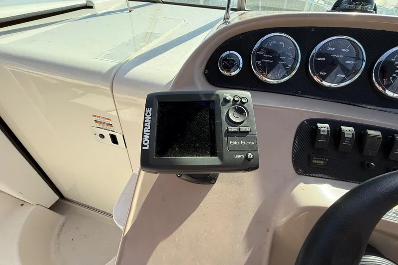 Slide: The Image of 1999 Chaparral Signature 300 dashboard with Lowrance Elite-5 DSI fishfinder and gauges. - 17